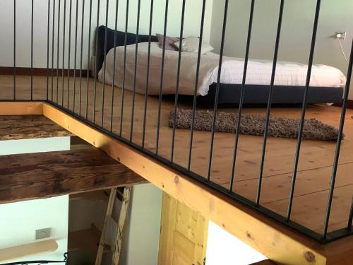a cage with a bed on top of it at B&B Maso Zont Antico Maso in Vignola