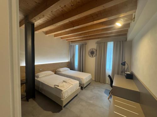 Ένα ή περισσότερα κρεβάτια σε δωμάτιο στο Hillside House Sant'Andrea