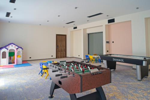 a room with a foosball table and a playset at SIA Resort and SPA in Tsaghkadzor