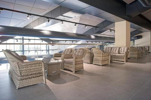 a row of wicker chairs in a waiting room at SIA Resort and SPA in Tsaghkadzor