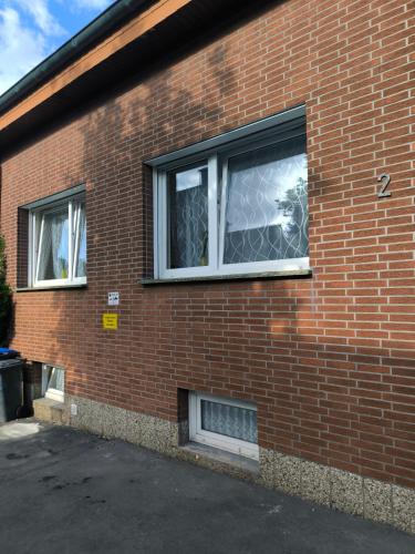 a brick building with two windows on the side of it at Mego in Werne an der Lippe