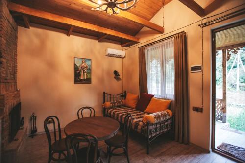 a living room with a couch and a table at Ethno Village in Shilda