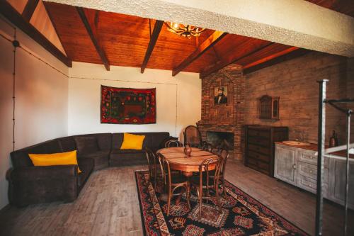 a living room with a couch and a table at Ethno Village in Shilda