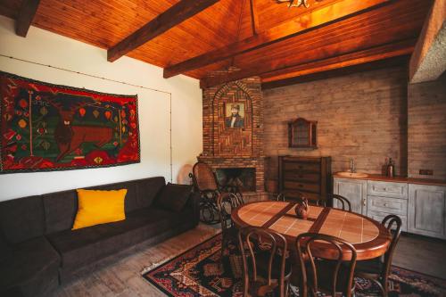 a living room with a couch and a table at Ethno Village in Shilda