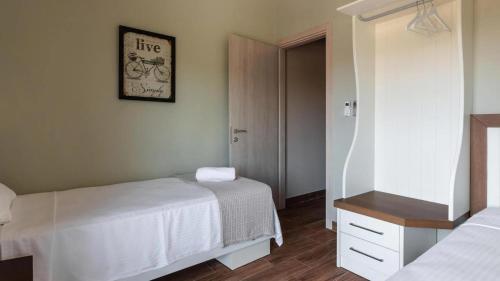 Кровать или кровати в номере Arteon villas