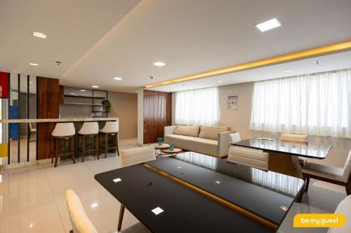 a living room with a couch and a table at Design 1 - Sobral in Sobral