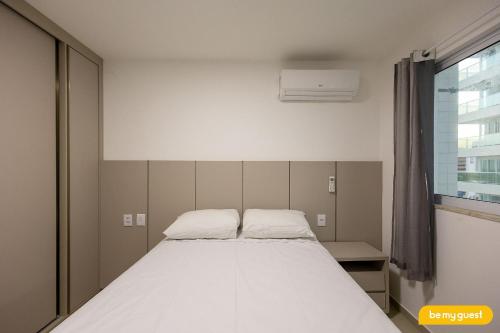 a large bed in a room with a window at Design 1 - Sobral in Sobral