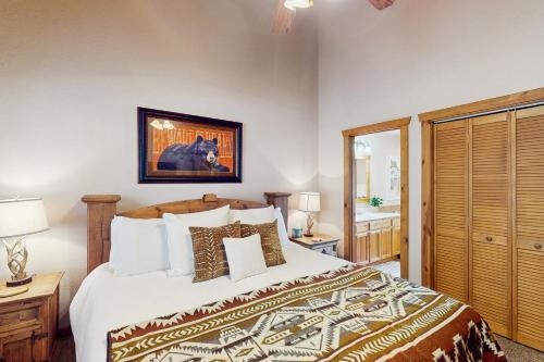 a bedroom with a large bed and a bathroom at Rest Haven in Branson West