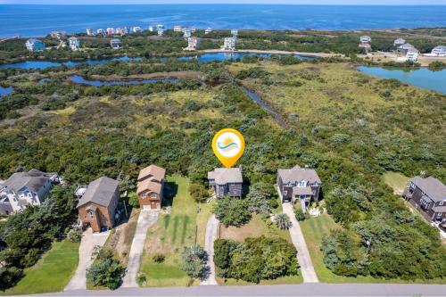 an aerial view of a house with a yellow balloon at 8455 - Mad Hatteras in Avon