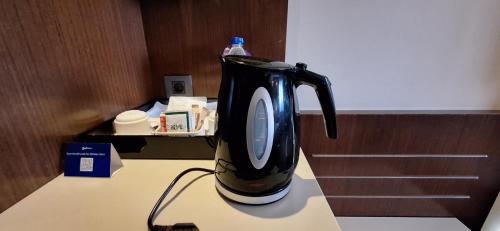 a black blender sitting on top of a counter at Radisson Blu Hotel, Addis Ababa in Addis Ababa