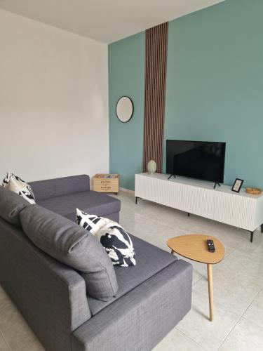 a living room with a couch and a tv at House 13 apartment in Cernobbio in Cernobbio