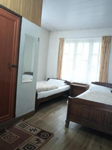 Postel nebo postele na pokoji v ubytování Yuven House