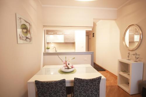 a living room with a table and two chairs at Apartments Belgrade in Belgrade