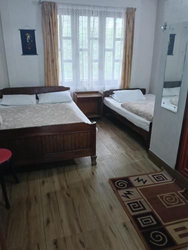 Postel nebo postele na pokoji v ubytování Yuven House
