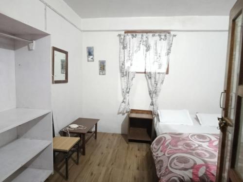 Postel nebo postele na pokoji v ubytování Yuven House