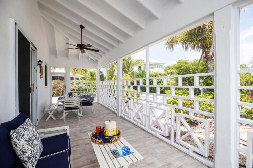 a porch with a view of the ocean at Ports of Call Resort in Grace Bay