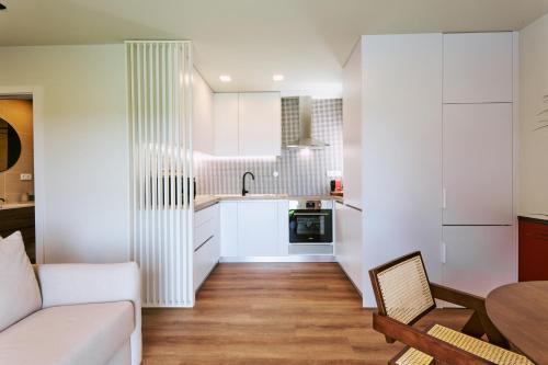 Kuchyň nebo kuchyňský kout v ubytování Espaço Quattro Apartamentos