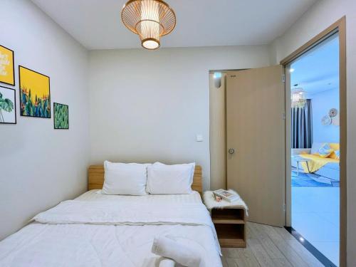 Postel nebo postele na pokoji v ubytování The Song Premium Apartment - Căn Hộ Du Lịch Biển - Anh Khoa Homestay