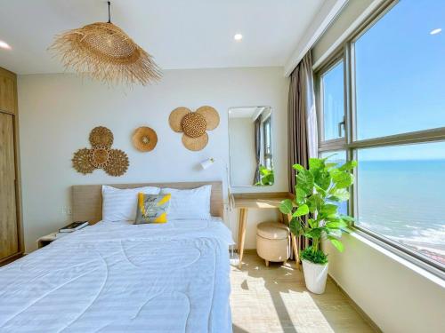 Postel nebo postele na pokoji v ubytování The Song Premium Apartment - Căn Hộ Du Lịch Biển - Anh Khoa Homestay