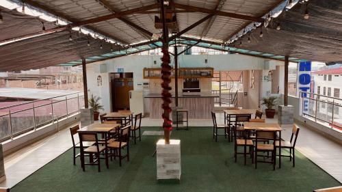 a dining room with tables and chairs in a building at Hotel Leyva in San Antonio