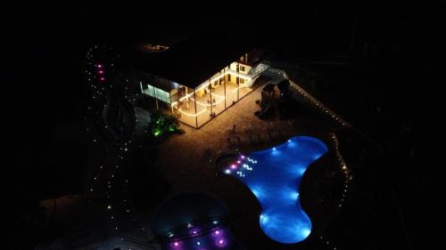 a view of a building with lights at night at hacienda hotel texas in Durania