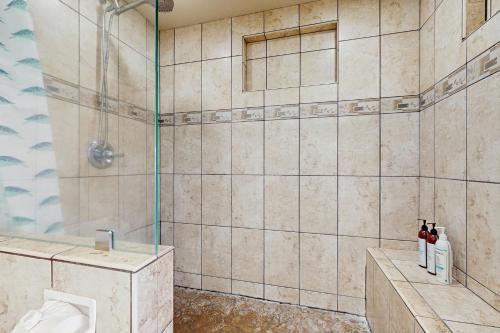 a bathroom with a shower with a toilet at Kahana Villa F410 in Kahana