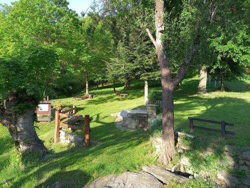 a park with a fence and trees and grass at La Casa di Simone in SantʼAmbrogio di Torino