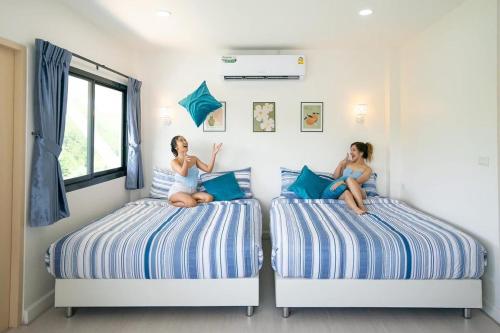 Ένα ή περισσότερα κρεβάτια σε δωμάτιο στο Viewlay Villa Cha am