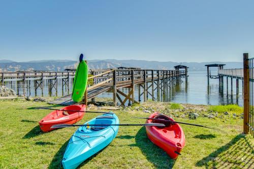 three kayaks sitting on the grass near a pier at Hot Tub, Views and Dock! Playful Home on Clear Lake in Nice