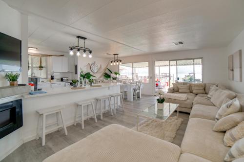 a large living room with a couch and a kitchen at Hot Tub, Views and Dock! Playful Home on Clear Lake in Nice