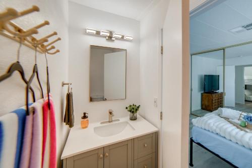a bathroom with a sink and a mirror at Hot Tub, Views and Dock! Playful Home on Clear Lake in Nice