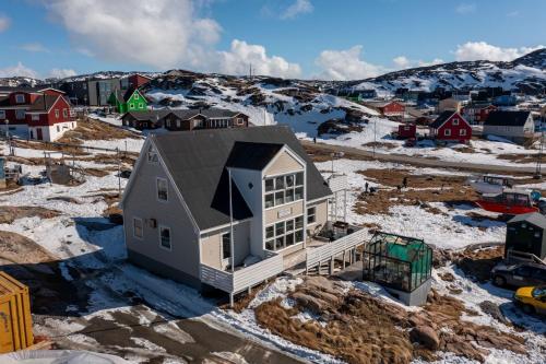 an aerial view of a house in the snow at Ilulissat Stay - Nanna's Villa - 1 in Ilulissat