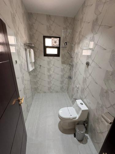 a bathroom with a toilet and a sink at فندق روابي جاردن إن ابها Rawabi Garden In ABHA Hotel in Abha