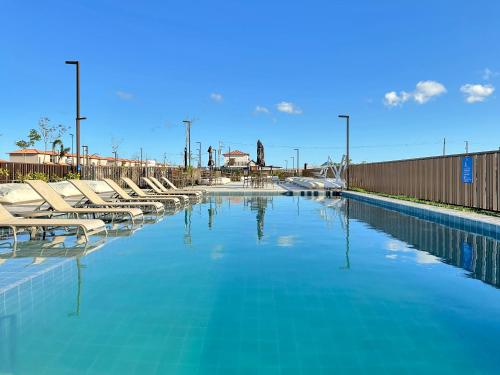 Πισίνα στο ή κοντά στο Condomínio Clube - Qto com cozinha - Ar condicionado