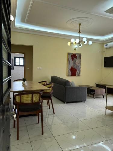 a living room with a couch and a table at Résidence Eden in Yaoundé