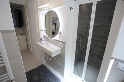 a bathroom with a sink and a mirror at Airport Palace Cinisi in Cinisi