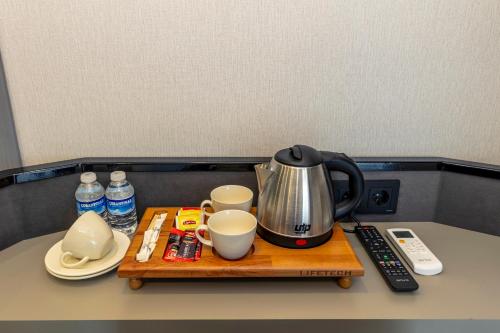a coffee maker on a tray on a table at The Private Airport Hotel in Istanbul
