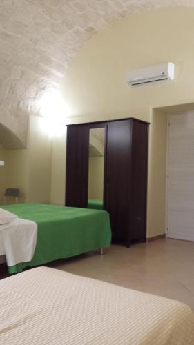 Ένα ή περισσότερα κρεβάτια σε δωμάτιο στο Beda Ragusa