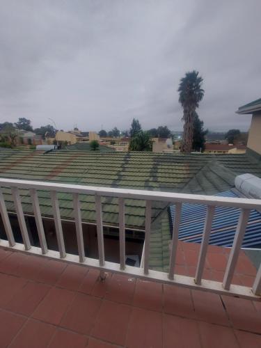 a view of a tennis court from a balcony at The Comfort Zone - Mthatha in Mthatha