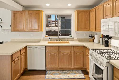 a kitchen with wooden cabinets and a sink at Great Family Home Located In Clarkdale in Clarkdale