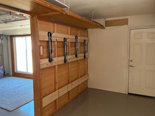 a large room with wooden walls and a door at Great Family Home Located In Clarkdale in Clarkdale