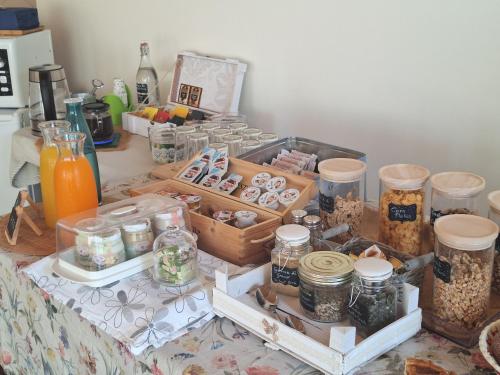 a table with jars and other items on it at B&B Borgo Arcadia in Poiana Maggiore