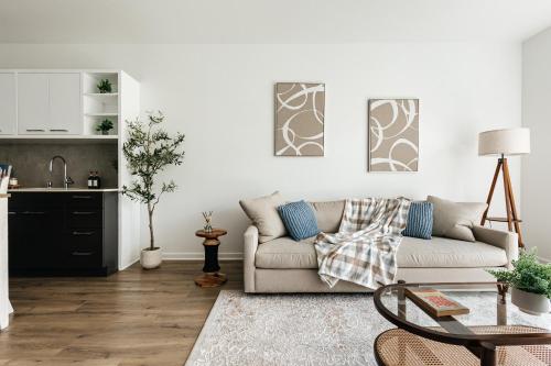 a living room with a couch and a table at Superior 2 bedroom apartment in Heart of Hollywood in Los Angeles