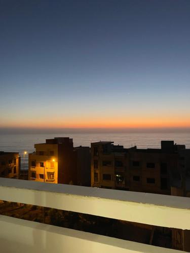 a view of the ocean from the roof of a building at Sunset Vibes Larache in Larache
