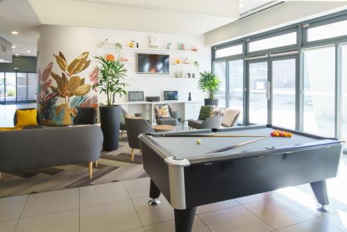 Coin salon dans l'établissement Holiday Inn Express Strasbourg Centre by IHG