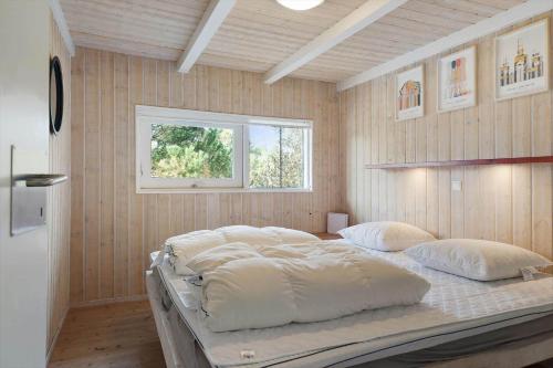 a large bed in a room with a window at TV1597-Albaek-Albaekvej-78 in Ålbæk