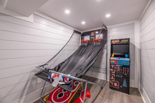a room with a basketball hoop and a basketball hoop at Experience Ocean Views at Pinstripe Paradise, 5 BR, Pool, Pets OK! in Avalon Bench