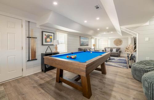 a living room with a pool table in it at Experience Ocean Views at Pinstripe Paradise, 5 BR, Pool, Pets OK! in Avalon Bench