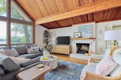 a living room with a couch and a fireplace at Unique LKN Waterfront Home with Dock in Mooresville