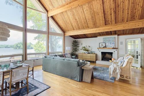 a living room with a couch and a fireplace at Unique LKN Waterfront Home with Dock in Mooresville